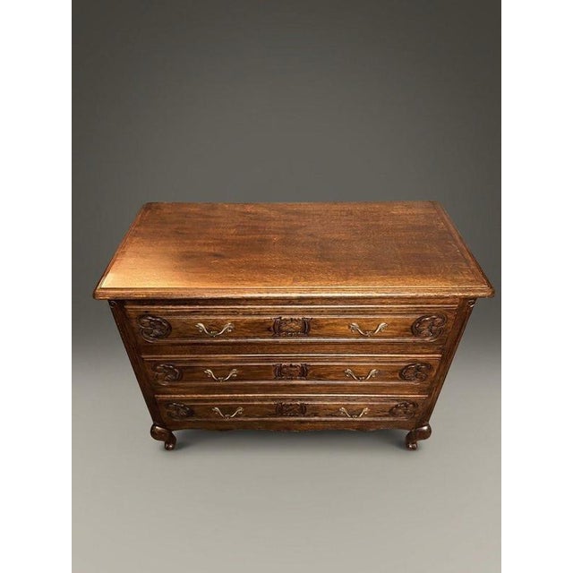 A stylish and characterful early 20th-century French chest of drawers, expertly crafted in rich stained oak. Designed with...