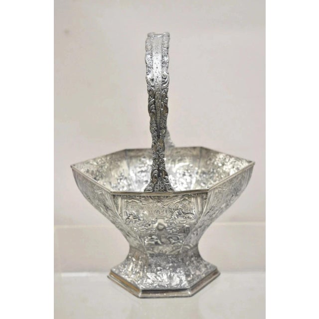 Antique Derby SP Co International Silver Plated Wedding Basket with Repousse. Item features unique village scenes, with...