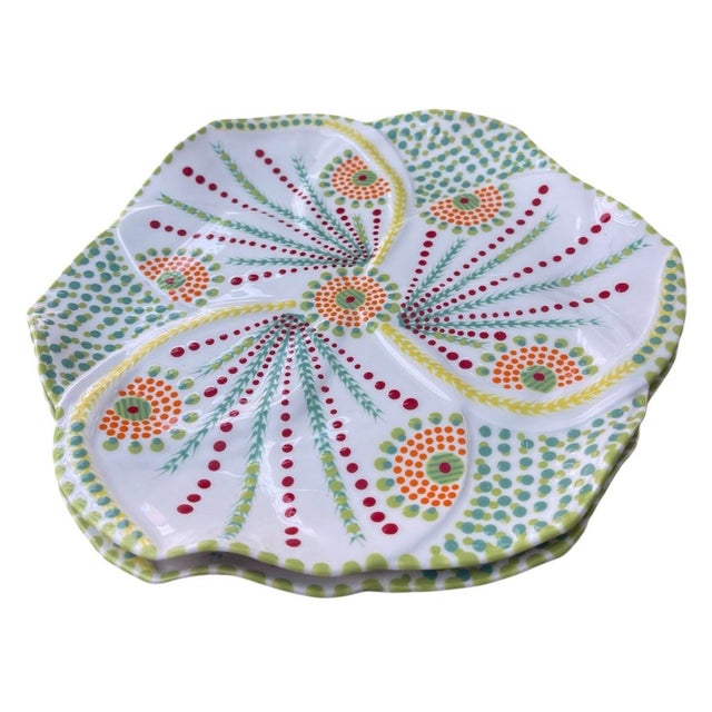 This exquisite pair of matching ceramic platters showcases the vibrant artistry and meticulous craftsmanship of South...