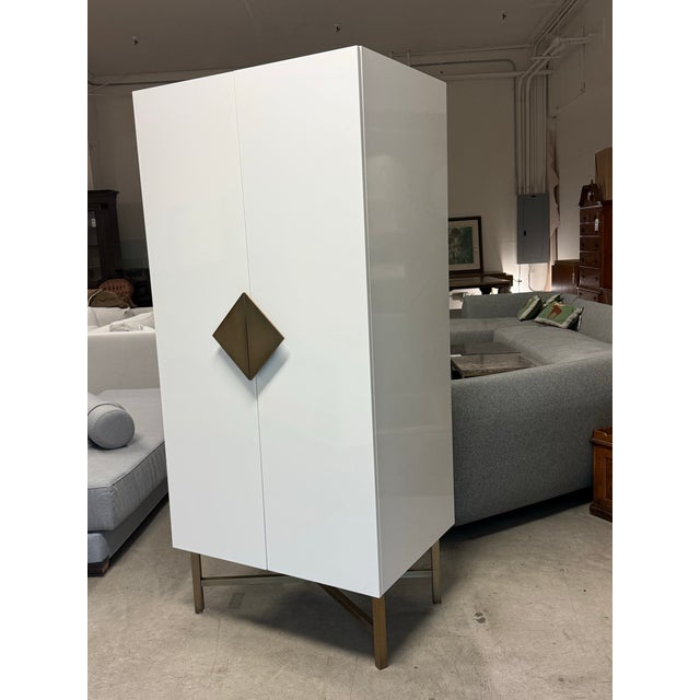 Design Plus Gallery presents the Astoria Wardrobe by VUUE for CB2. This white wardrobe gleams as hideout for clothes and...