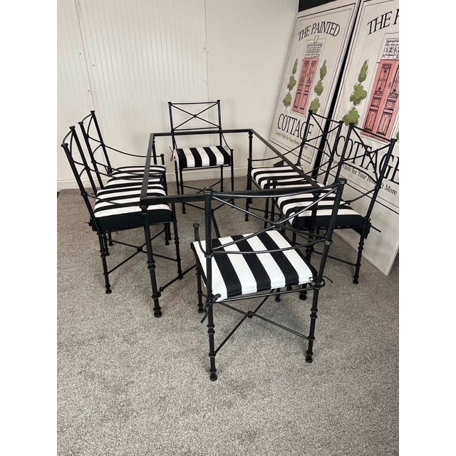 What classic large set of hammered black wrought iron out door dining chairs. Styled after Giacometti with new striking...