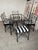 What classic large set of hammered black wrought iron out door dining chairs. Styled after Giacometti with new striking...