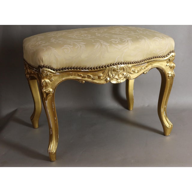 Giltwood stool in the louis xv style, dating from the napoleon iii period. The upholstery of this stool is in good...