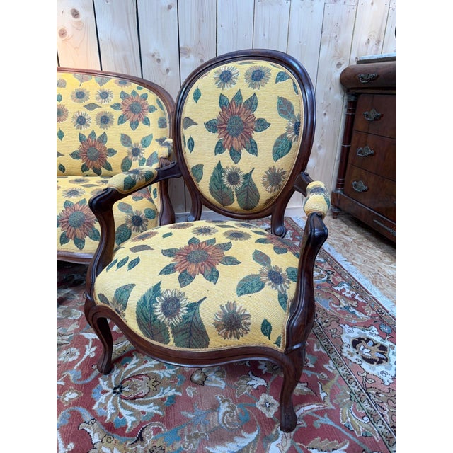 A louis-philippe period living room set, comprising a sofa and a pair of armchairs in dark brown stained rosewood. the...