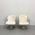 A striking pair of vintage Woodard swivel lounge chairs featuring sculptural cast aluminum frames with gracefully arched...