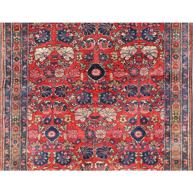 Measures: 4'5 x 6'5 Antique Persian Bidjar Rug with Red Field and Bold Blue Floral Design. Keivan Woven Arts/...