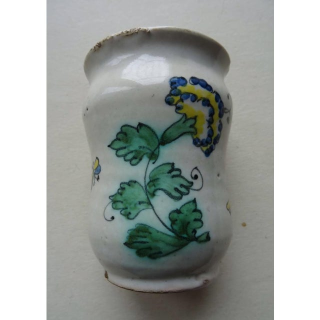 This enchanting antique Italian majolica albarello is a captivating small vase, showcasing the vibrant polychrome...