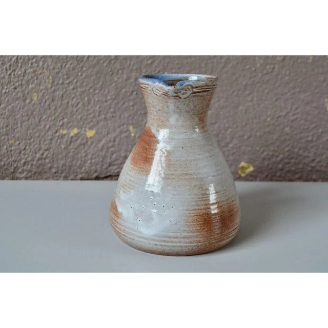 This pretty ceramic pitcher is a very delicate piece, produced by the Pierlots for their usual and decorative purposes....