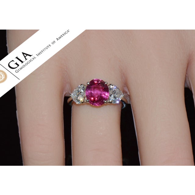 GIA-certified 4.47CTS natural ruby and diamond three-stone ring crafted in solid 950 platinum. This ring features a 3.07CT...
