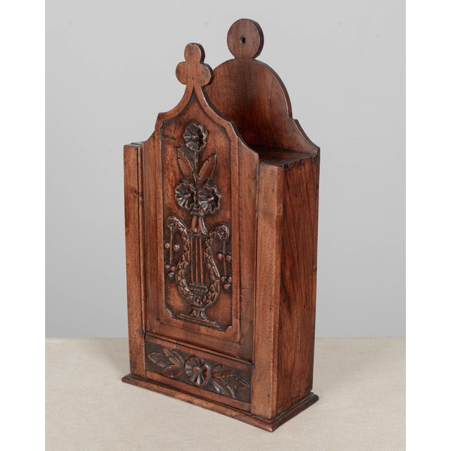 A 19th century French fariniere, made of walnut with nicely detailed hand-carved floral relief on front panel. Good...