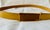 A vintage Prada leather belt in mustard/gold/tan, featuring a fully adjustable gold and brown enamel buckle stamped with...