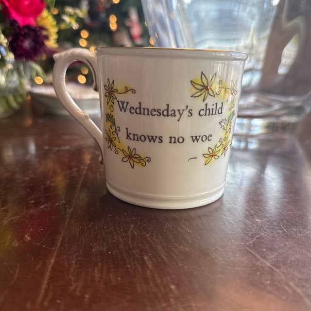 This charming Royal Worcester hand-painted mug features the whimsical "Wednesday's Child" design, part of the Days of the...
