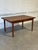 This beautiful expandable dining table features a minimalist rectangular top profile supported by sleek square tapered...