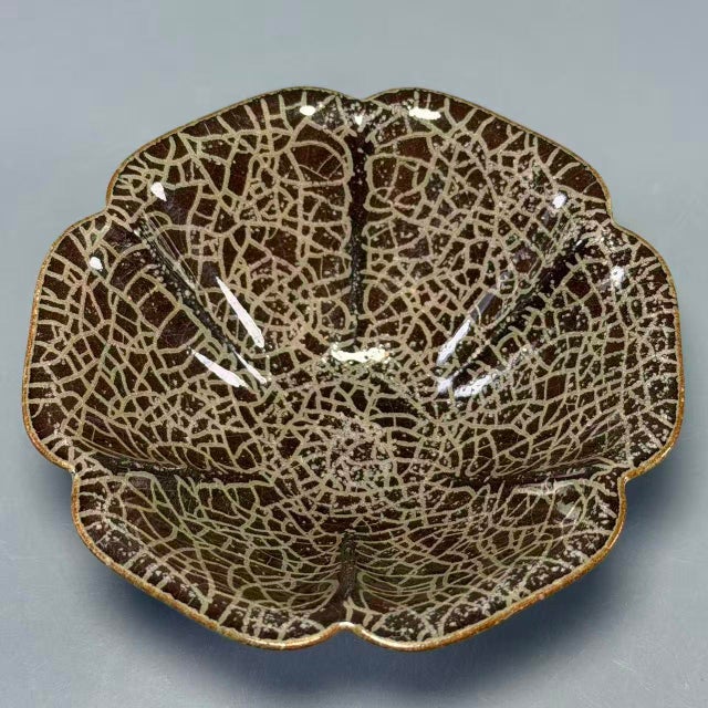 An exceptionally expressive Chinese foliate‑rim bowl, shaped in graceful flared petal‑lobed silhouette. Its surface is...