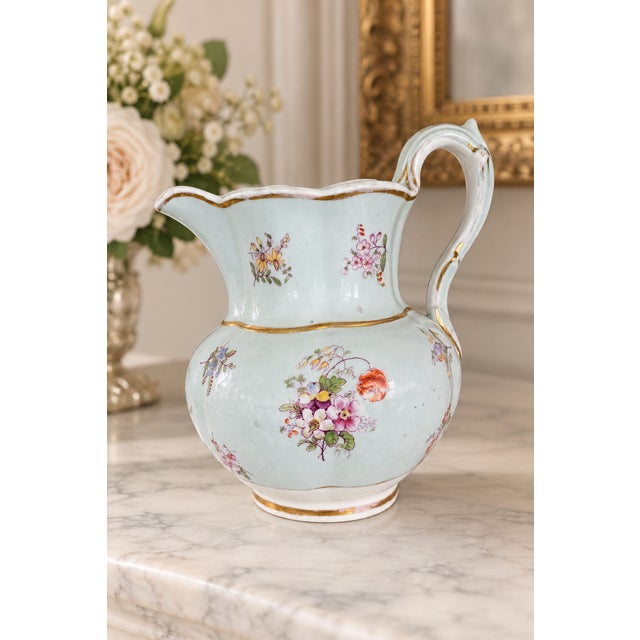 An elegant late-19th- to early-20th-century Continental European porcelain pitcher, likely German or Bohemian, decorated...