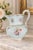 An elegant late-19th- to early-20th-century Continental European porcelain pitcher, likely German or Bohemian, decorated...