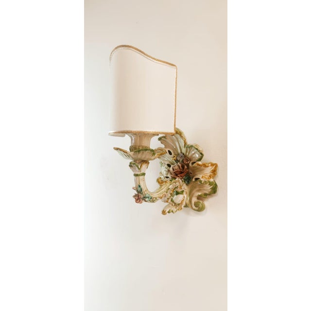 Ceramic Wall Light Decorated with Flowers with Fabric Fan, in Flawless conditions. Designed 1920 to 1949 Up to 250V...