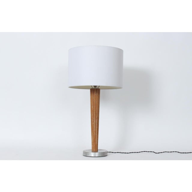 Russel Wright Style Cerused Oak & Spun Aluminum Table Lamp, 1940's. Featuring a turned, tapered and smoothly ribbed Limed...