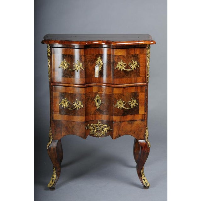 Antique Dresden chest of drawers, oak with walnut veneer, around 1870 Solid oak body with very fine walnut root veneer....