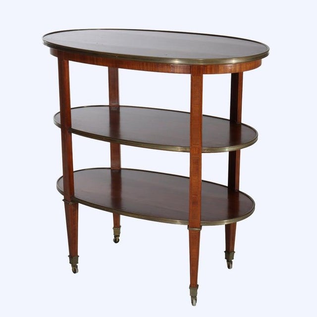 Presenting and antique English Regency breakfast server with rosewood construction and having three tiers, inlayed panels...