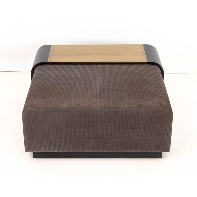 Lumifer "Obi" Suede Upholstered Ottoman, in gray with textured design and removable brass and ebonized wood sliding tray...