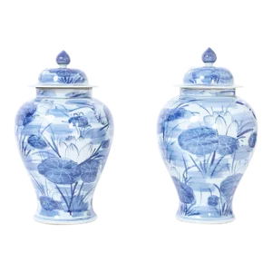 Pair of Blue and White Porcelain Lidded Urns With Lilies
