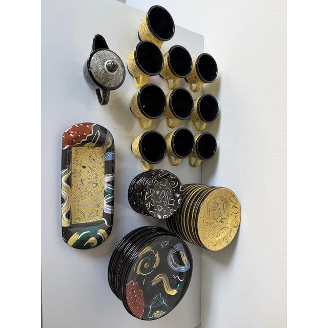 An exceptional and vibrant 1990’s Postmodern ceramic dinnerware collection by Claudia Reese, featuring a complete 53-piece...