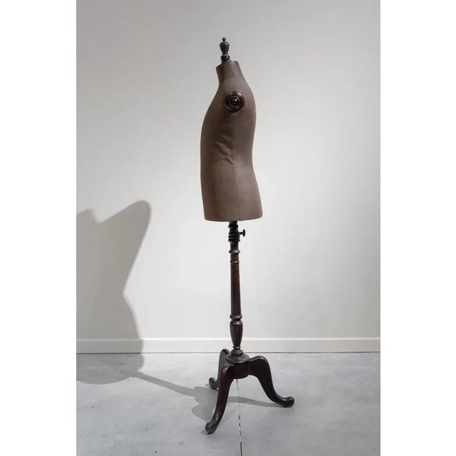 Ancient mannequin of gentleman with body in fabric and support in turned wood on typode. It retains the original mechanism...