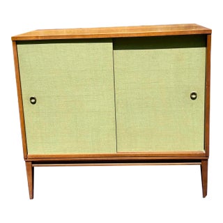 Paul McCobb Planner Group Sliding Door Cabinet in Tobacco Maple With Aqua Grasscloth Doors For Sale