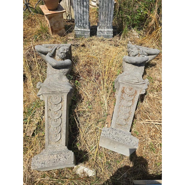 Impressive pair of monumental stone sculptures dating from the early 20th century, expertly hand-carved with remarkable...