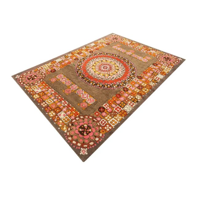 Wonderful Rug from the 1970s. Brown flor with a pattern in orange, cream and pink tones. Characteristics: - High quality...