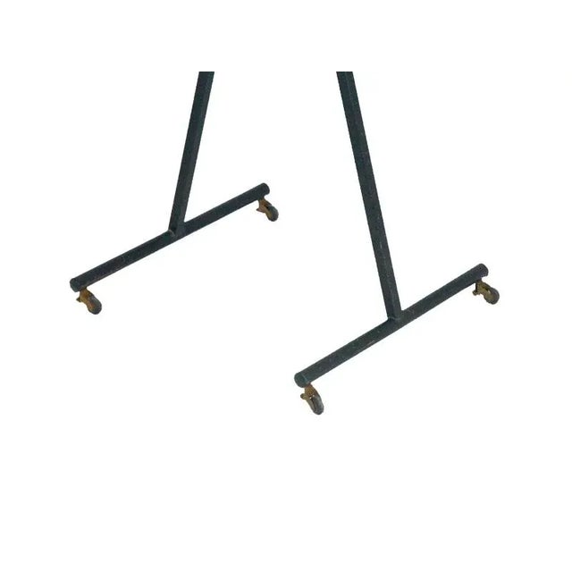 This Italian valet stand is made from painted metal wood and anodized aluminum; it is foldable and it comes with 4 usefull...