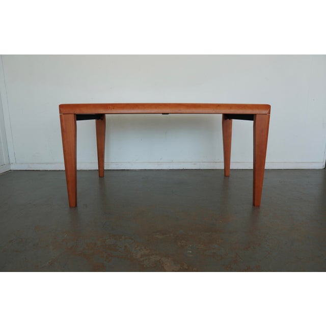 This vintage Calligaris S.p.A. dining table is a striking example of Italian modern design, blending clean architectural...