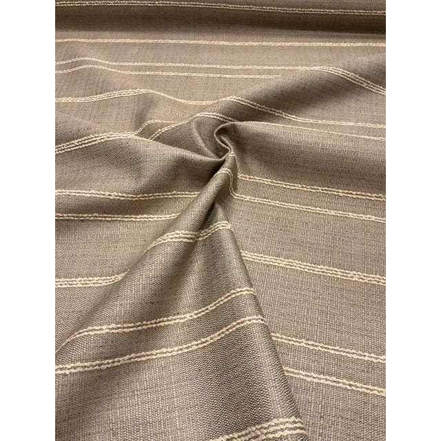 This timeless khaki and cream striped linen has a soft hand and is multipurpose. This fabric is a great quality good and...