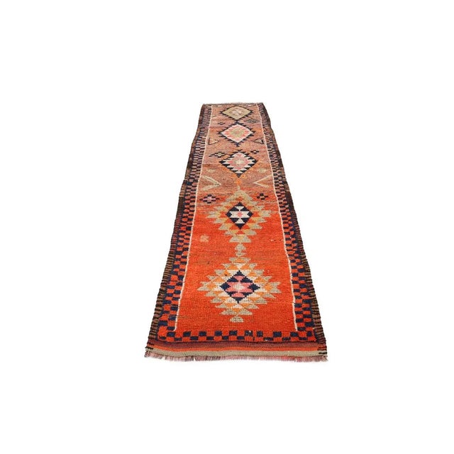Handknotted vintage decorative Herki runner from Northern Iraq. Approximately 50-60 years old. In very good condition.