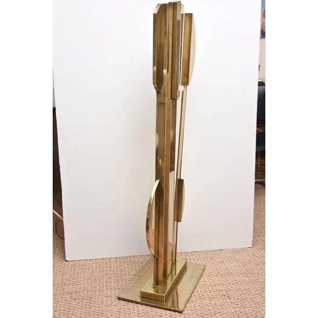 This heavy and fantastic solid bronze floor sculpture is geometric with lyrical forms. It is signed on the left hand side...