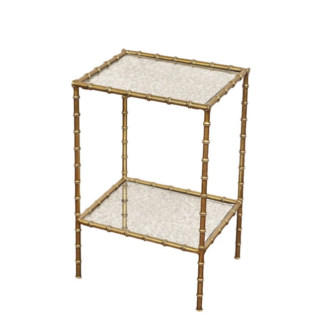 New Bamboo and brass two-tier table features a Venetian glass inset, adding an elegant touch to any space. 15.5" L x 12.5"...