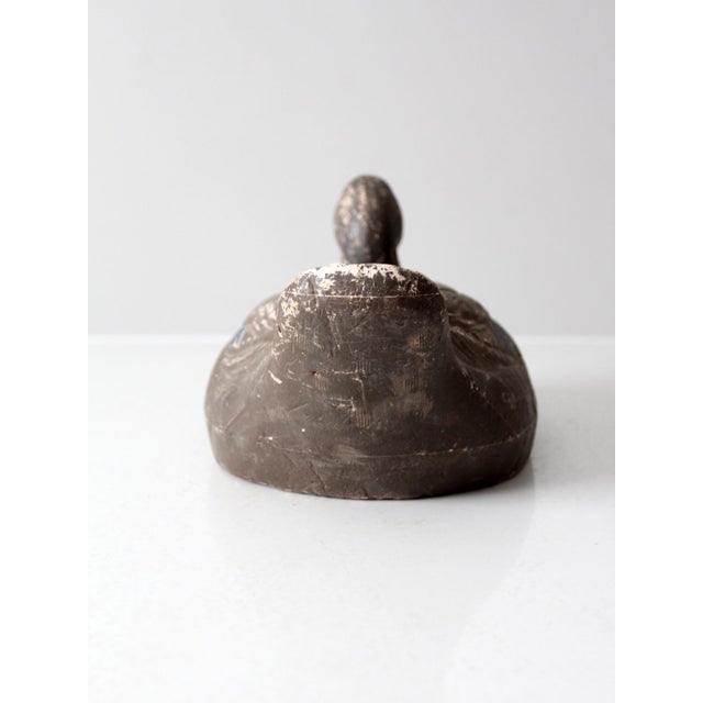 This vintage mid-20th century Carry-Lite mallard hen decoy from Milwaukee features a detachable head with a cork and ring...