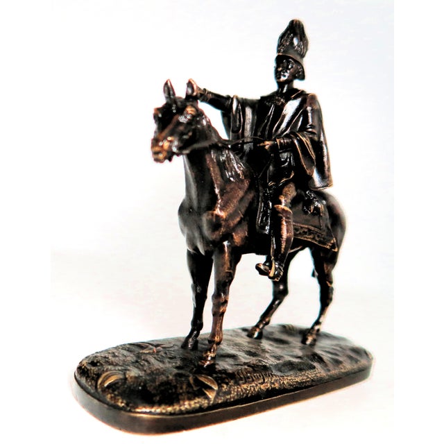 This very interesting French patinated antique bronze horse and rider depicts the rider pointing to something. To me, he...
