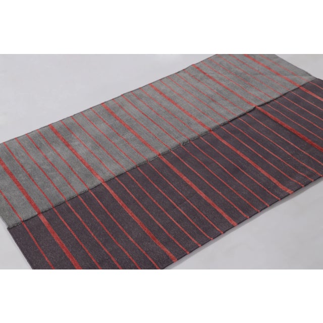 This modern 3 x 5 dhurrie rug from India presents a striking minimalist composition defined by bold color contrast and...