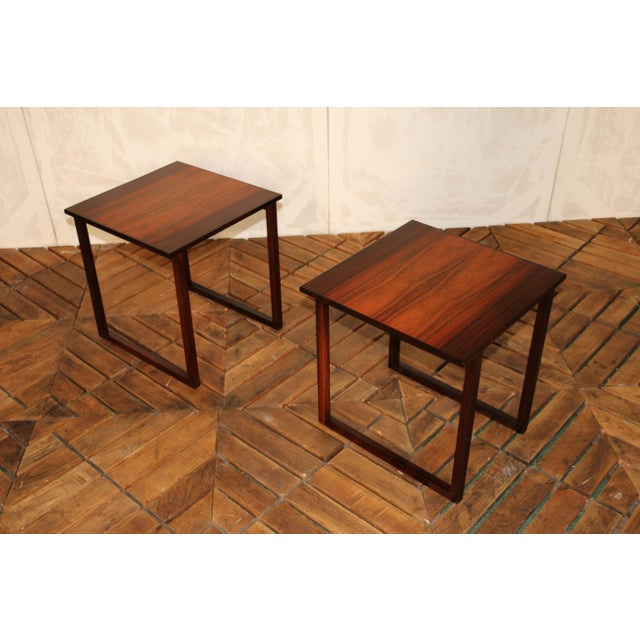 Elegant pair of Mid-Century Modern side tables designed by Kai Kristiansen, crafted in Denmark during the 1960s. Each...