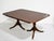 Mid century Georgian dining table by Kindel Furniture features a warm brown wood finish and a rectangular banded top with...