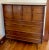 This beautiful vintage highboy dresser with mid-century modern design includes unique trim and classic MCM legs. The clean...