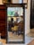 A tall and imposing 19th century giltwood pier mirror with a strong architectural presence. The broken pediment cornice is...