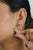 These double halo stud earrings showcase 1.64 carats of emerald-cut rubies, set in 14k white gold. Each ruby measuring 6.1...