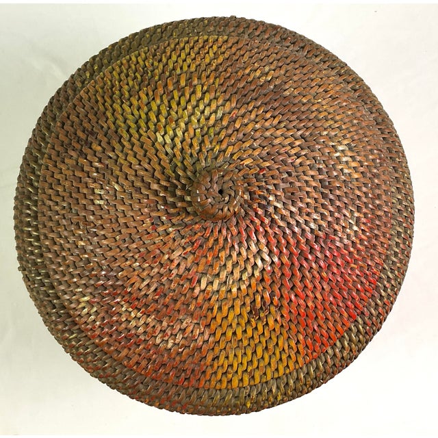 -rattan basket with lid-wonderful patina ,with remnants of a painted design-woven by a master craft person Circa the 1920s...