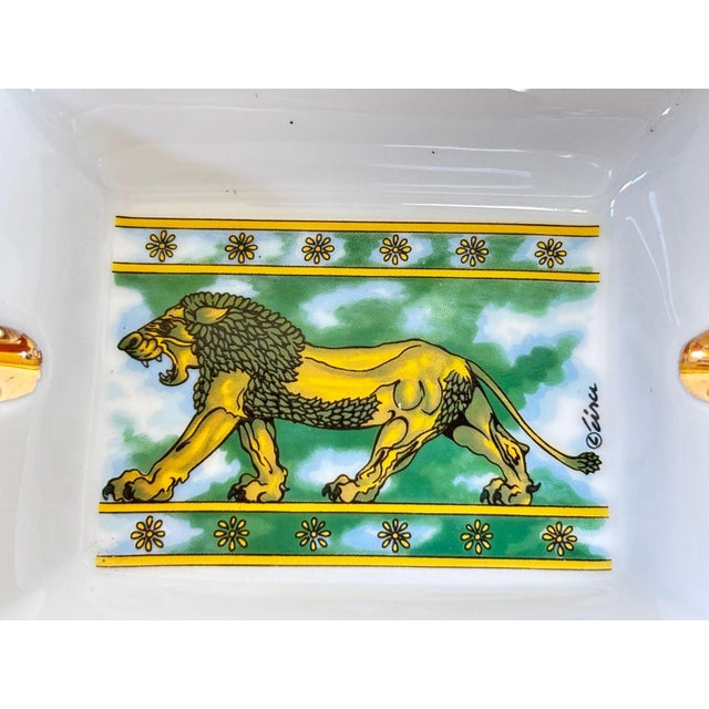 French Porcelain Lion Ashtray Vide-Poche with Gilt Decoration A charming and finely detailed porcelain ashtray or catchall...