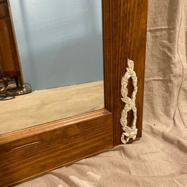 Custom made Trumeau mirror in the French style with applied white Louis XV neoclassical design elements such as...