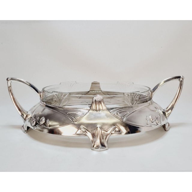Art Nouveau silver-plated centerpiece by Dupper & Bernhold, dating back to the 1910s. This elegant piece features its...