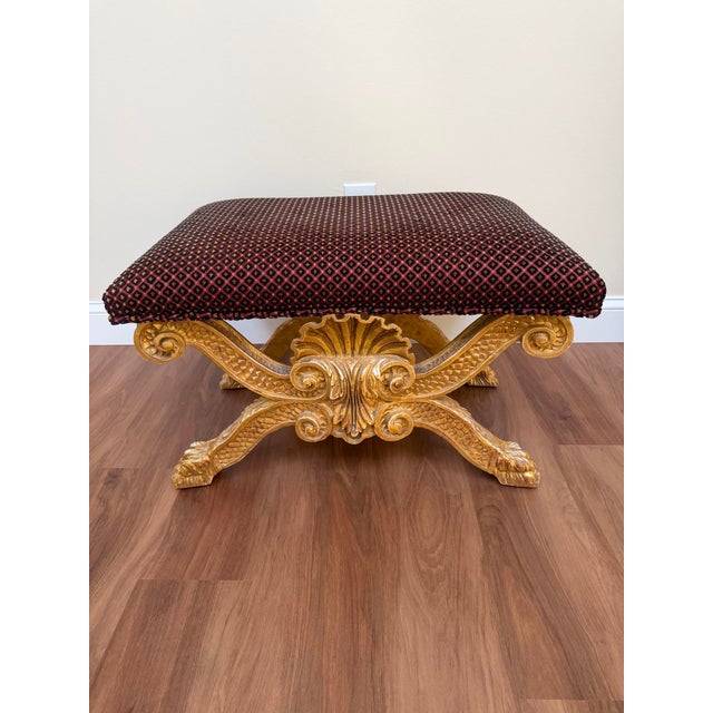 George II style giltwood X-frame stool by Charles Pollock, produced as a high-quality reproduction of the celebrated circa...